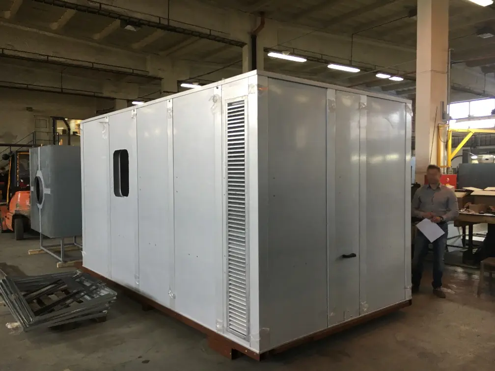 Large modular metal acoustic enclosure for an industrial system in a manufacturing facility